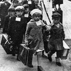 Finnish children with suitcases being evacuated from the country during World War II