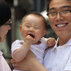 Father holding small child