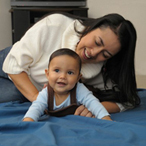 Mother and baby enjoying tummy time together.