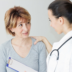 Woman talking with a healthcare provider.