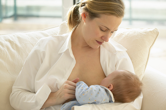 Mother breastfeeding baby.