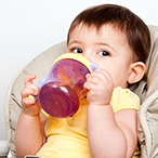 Toddler drinking from sippy cup.