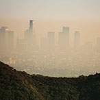 City skyline viewed through a haze of air pollution.