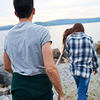 A man follows a young woman.