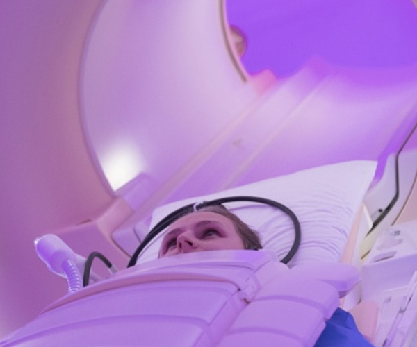 A woman in a magnetic resonance imaging scanner.