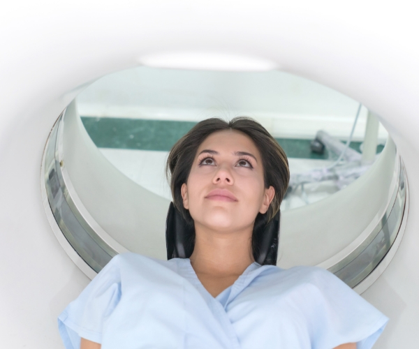A woman in a magnetic resonance imaging scanner.