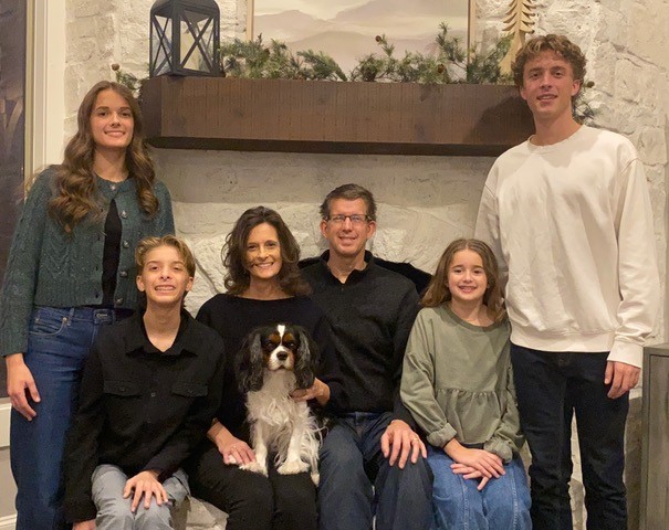 The Van Wyk family: from left Julia, Graham, Anne, Jerry, Natalie, and Drew. The family’s dog, Kingston, is seated on Anne’s lap.