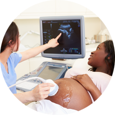 Pregnant woman viewing ultrasound.