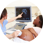 Pregnant woman viewing ultrasound.