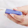 Woman holding a blank pregnancy test in her hand