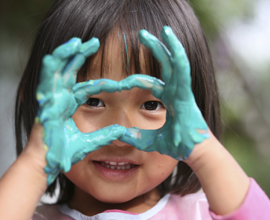 Child with paint on hands