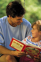 Father and daughter reading together